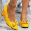 Newness Sunshine Stroll Glossy Yellow Wedge Bow Heels Step into sunshine with these elegant yellow wedge heels featuring a glossy finish and charming bow detail Perfect for adding a touch of summery sophistication to any outfit