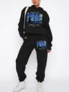 Model wearing the Newness Celestial Dreams Starry Night Tracksuit a cozy fleece tracksuit perfect for autumn and winter The tracksuit features a stunning starry night print