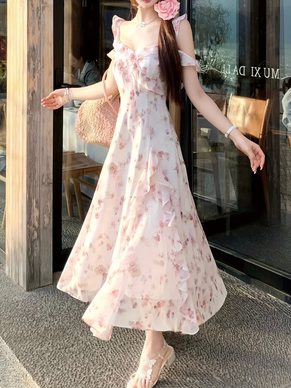 Model wearing a stunning Newness Summer Solstice Floral Print Maxi Dress showcasing its lightweight chiffon fabric asymmetrical hemline and beautiful floral print The dress flows gracefully