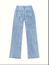 Model wearing Newness Dubai Breeze Wide Leg Jeans a light wash high waisted pair of wide leg jeans