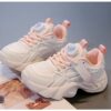 Pastel Petal Girls Sneakers with Rotating Buckle Closure   Trendy pastel pink and white sneakers with a unique rotating buckle perfect for school playdates and sports Breathable comfort and durable rubber sole
