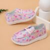 Adorable girls heart pattern loafers in a soft breathable fabric Perfect for everyday wear these slip on shoes offer both comfort and style