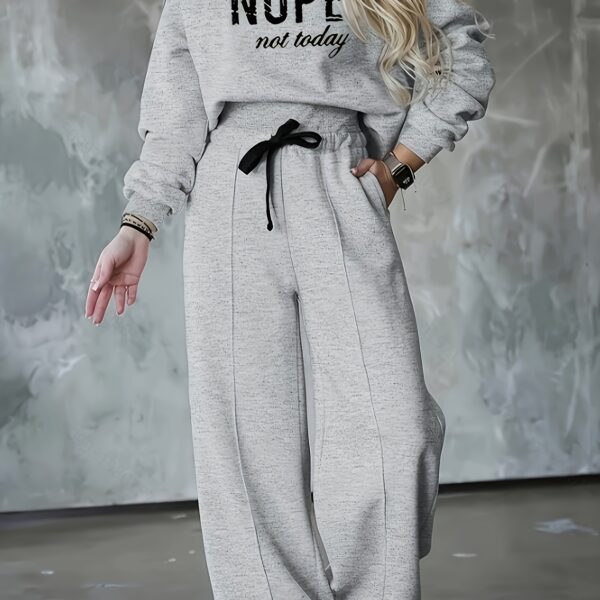 The Newness Effortless Chic Letter Print Lounge Set: A stylish and comfortable two-piece loungewear set featuring a relaxed, modern silhouette and a chic letter print.