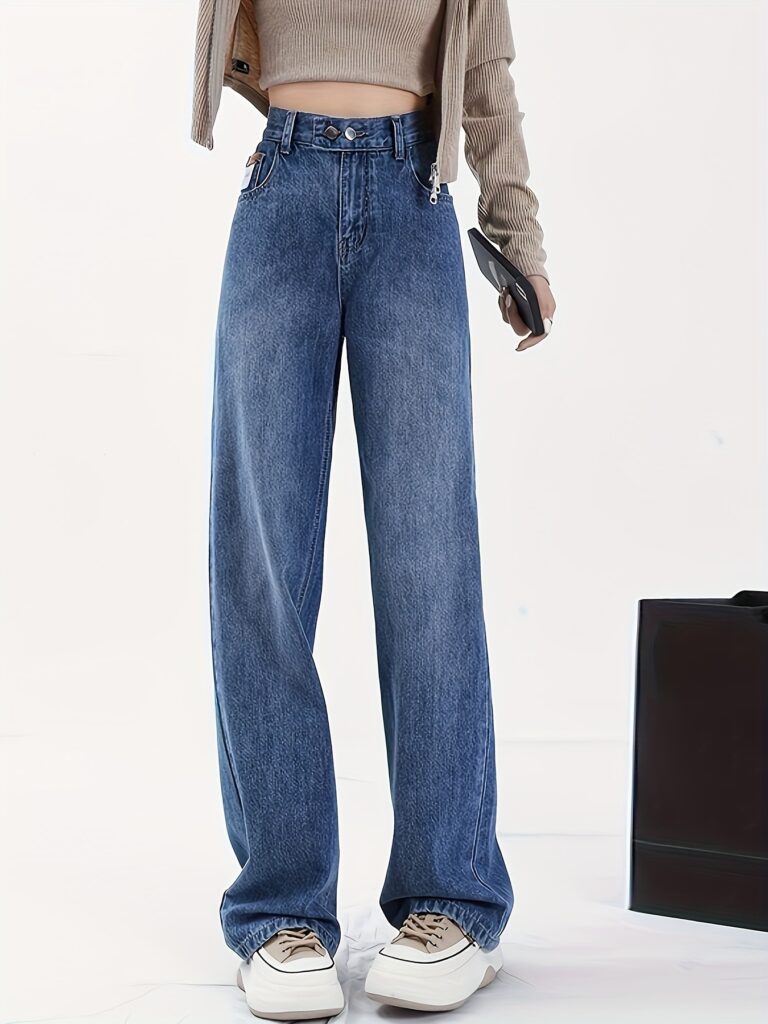 Newness Vintage Straight Leg Jeans: A model wearing perfectly fitting, light wash straight leg jeans with a vintage look.