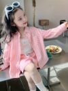 Adorable girl wearing Newness Riviera Chic summer outfit a stylish and breathable dress perfect for sunny days