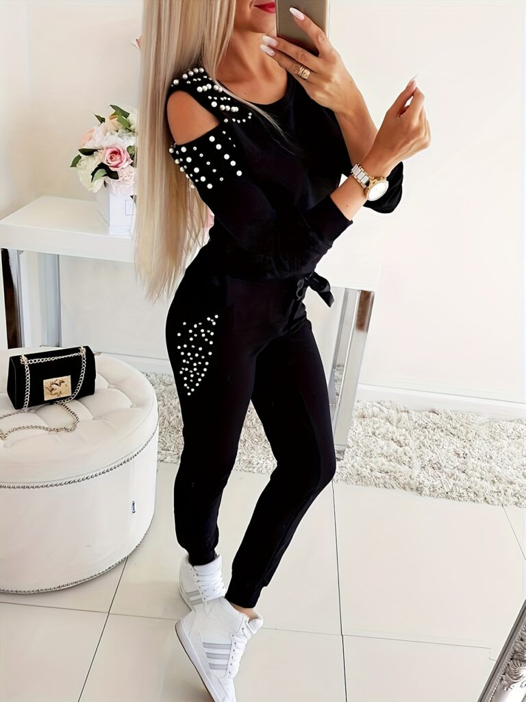 Elevate your style with the Newness Chic Pearl Embellished Two-Piece Set. This stunning outfit features a sophisticated design with pearl embellishments, perfect for any occasion. Effortless chic meets modern sophistication.