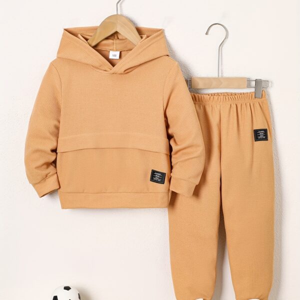 Newness Cozy Champ Boys Waffle Knit Set in soft waffle knit fabric featuring a hooded top and pants perfect for winter adventures