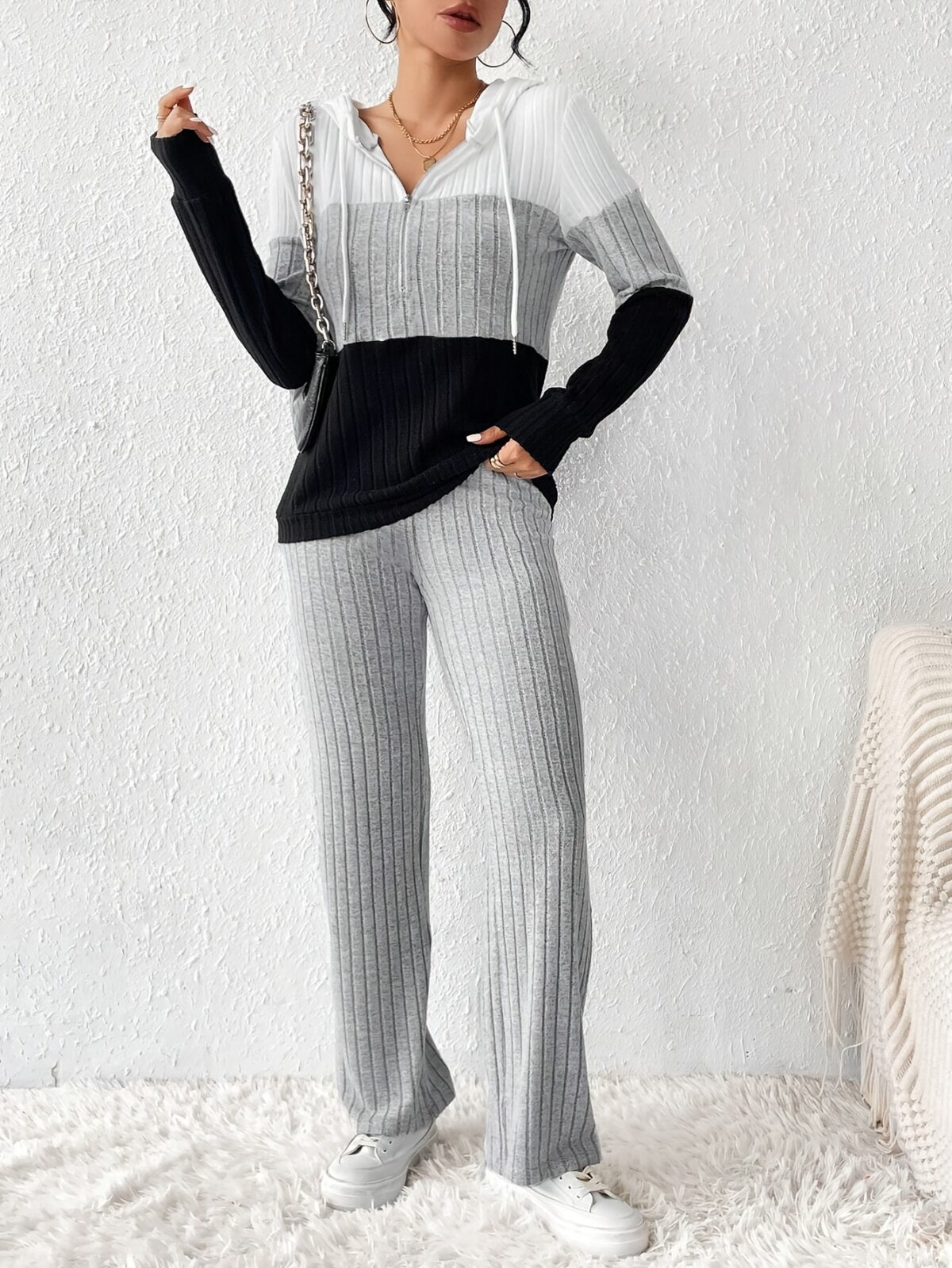 The Newness Riviera Color Block Hoodie Set in a flattering pose showcasing its vibrant color blocking and comfortable fit Perfect for spring or fall