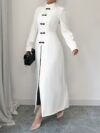 Flattering Timeless Chic Womens Stand Collar Tunic in versatile 100 polyester Featuring a chic stand collar and contrast button details this tunic offers elegance and comfort for all seasons