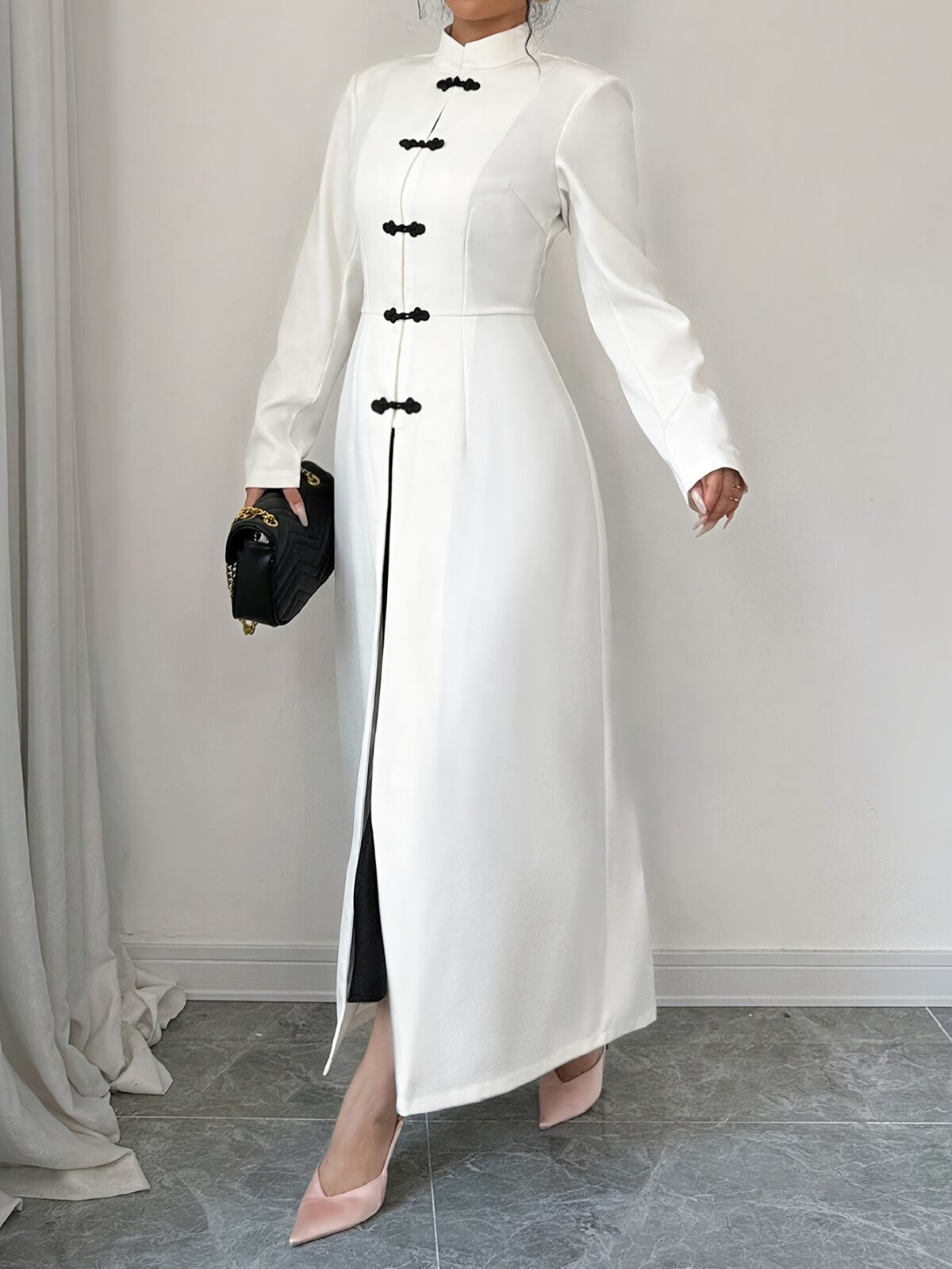 Flattering Timeless Chic Womens Stand Collar Tunic in versatile 100 polyester Featuring a chic stand collar and contrast button details this tunic offers elegance and comfort for all seasons