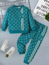 Stylish toddler boy wearing a trendy color block two piece outfit perfect for spring or autumn The outfit features a comfortable soft knit fabric in a vibrant color block design
