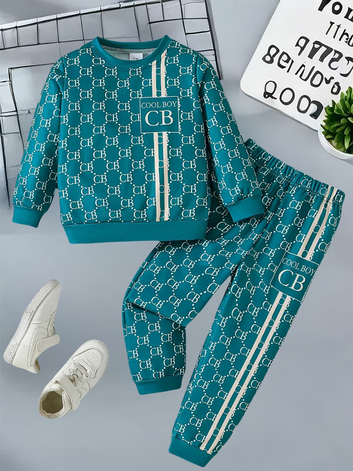 Stylish toddler boy wearing a trendy color block two piece outfit perfect for spring or autumn The outfit features a comfortable soft knit fabric in a vibrant color block design