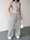 The Newness Riviera Striped Trouser Set in a flattering pose showcasing its relaxed fit and chic style Model is wearing the matching top and trousers