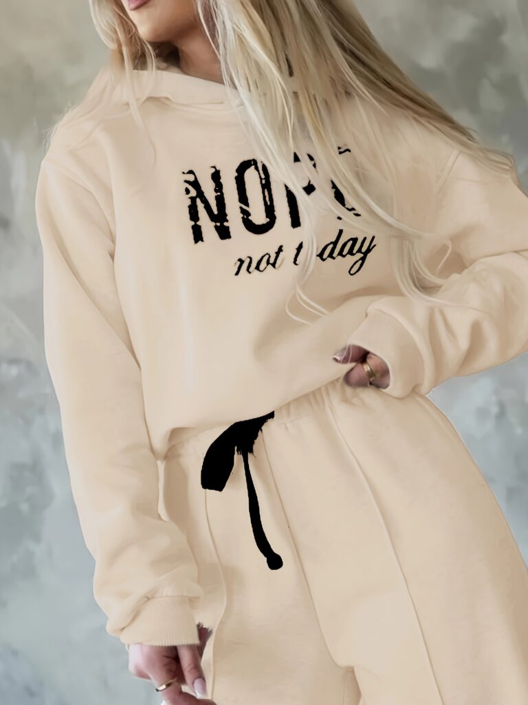 The Newness Effortless Chic Letter Print Lounge Set: A stylish and comfortable two-piece loungewear set featuring a relaxed, modern silhouette and a chic letter print.