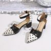 Chic Parisian Polka Dot Mary Janes from Newness A stylish pair of black and white polka dot Mary Jane shoes perfect for summer