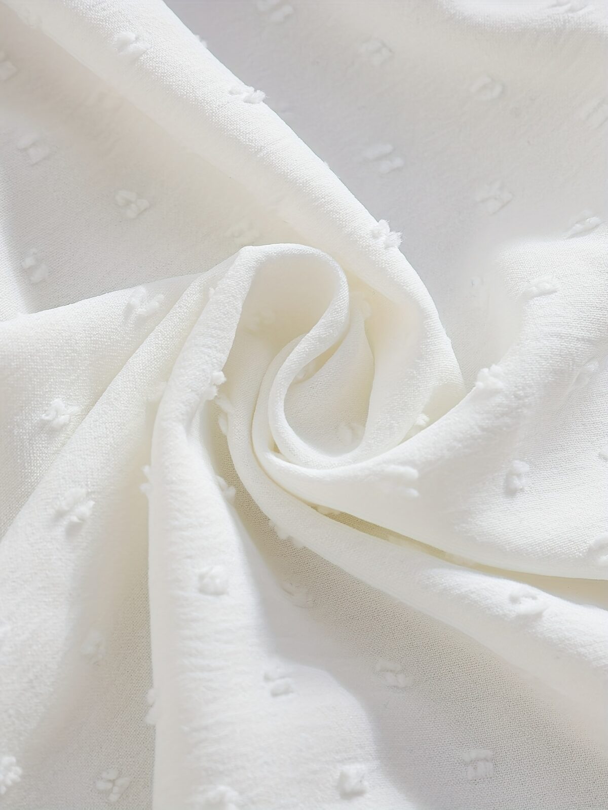 Newness Kensington Jacquard Floral Dress A chic and elegant floral dress perfect for spring Close up view showing the intricate jacquard fabric and flattering silhouette