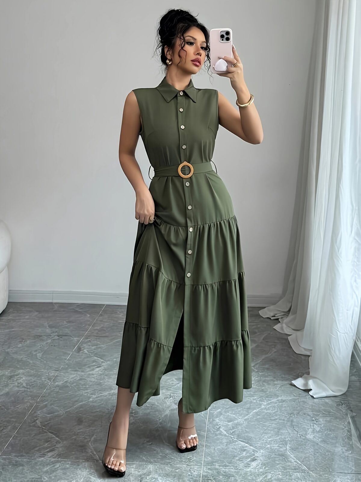 Model wearing the Newness Cairo Nights Geometric Print Dress a chic belted dress perfect for summer featuring a striking geometric print