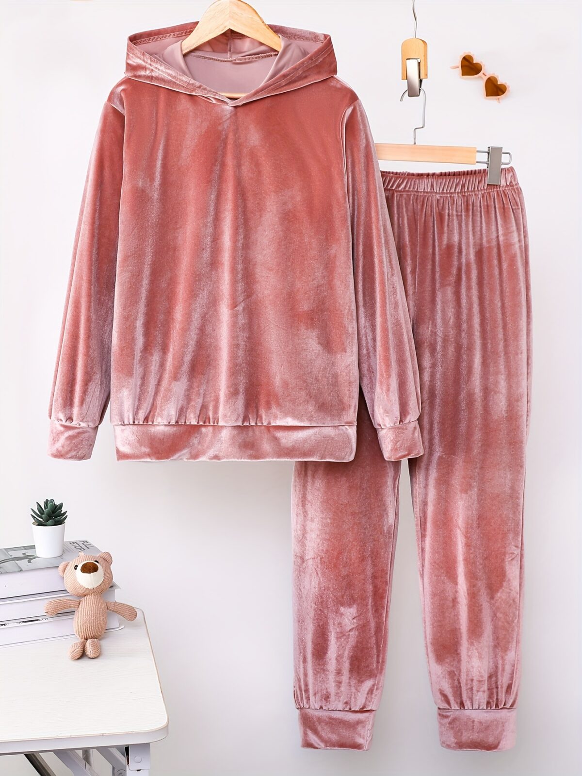 Indulge in ultimate comfort with the Newness Luxe Lounge Velvet Hooded Set This luxurious loungewear set features a plush velvet fabric and a flattering hooded design perfect for relaxing at home or running errands in effortless style