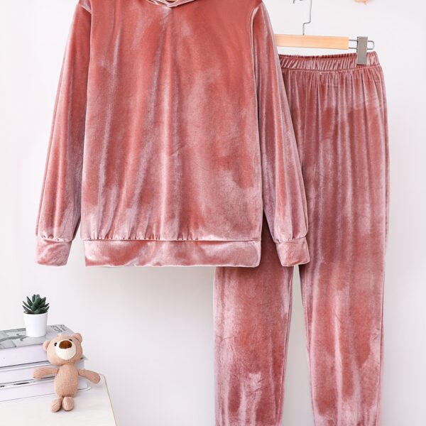 Indulge in ultimate comfort with the Newness Luxe Lounge Velvet Hooded Set. This luxurious loungewear set features a plush velvet fabric and a flattering hooded design, perfect for relaxing at home or running errands in effortless style.