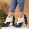 Elegant black lace up high heels with a block heel and ankle strap