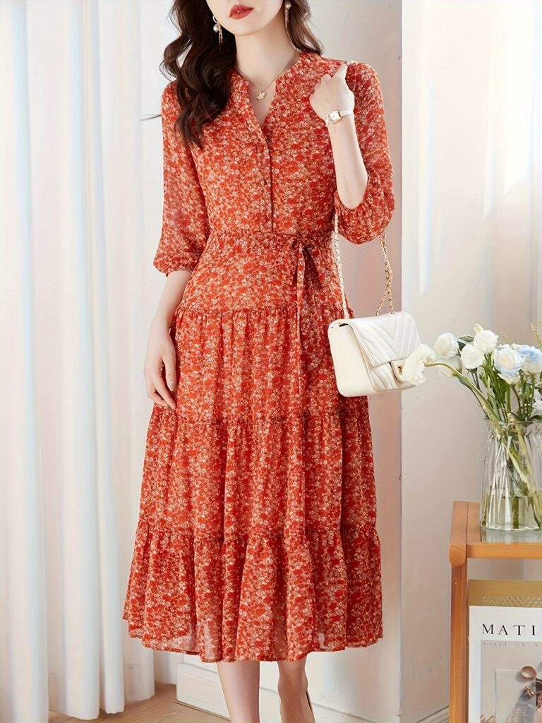 The Casablanca Floral Midi Dress from Newness, a chic floral midi dress perfect for spring and summer. Flattering silhouette and vibrant floral print.