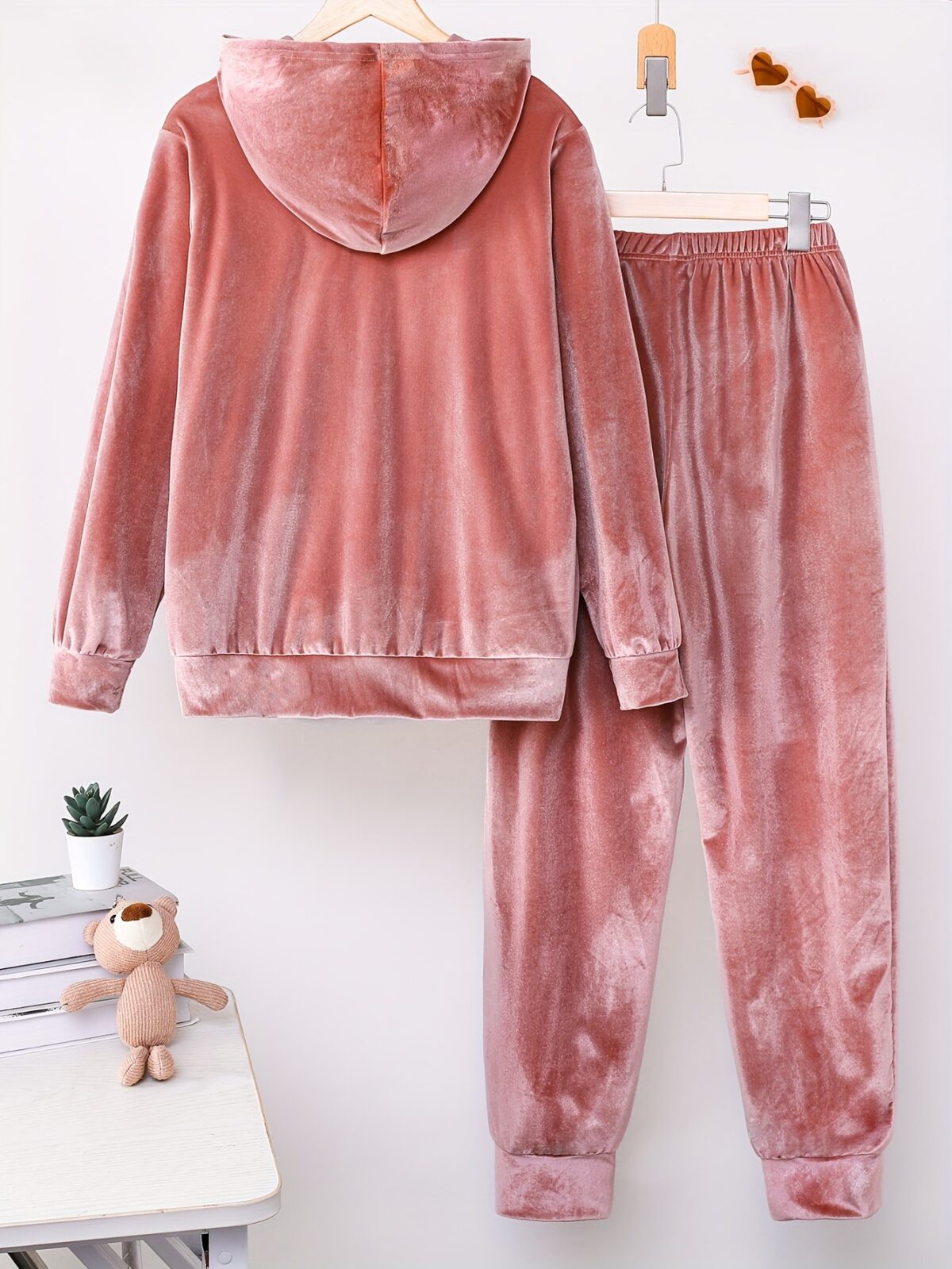 Indulge in ultimate comfort with the Newness Luxe Lounge Velvet Hooded Set This luxurious loungewear set features a plush velvet fabric and a flattering hooded design perfect for relaxing at home or running errands in effortless style