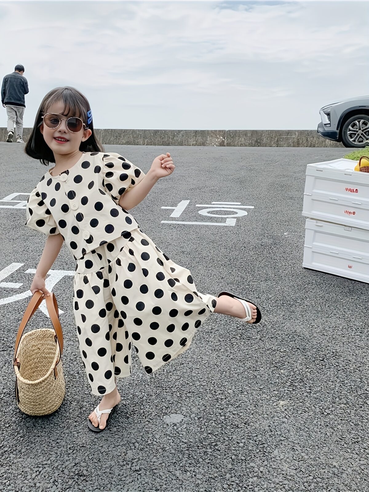 Adorable girls polka dot suit perfect for summer made from 100 soft cotton The suit features a mention specific details like sleeveless top and shorts or skirt design