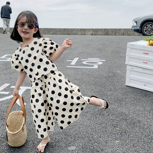 Adorable girls polka dot suit perfect for summer made from 100 soft cotton The suit features a mention specific details like sleeveless top and shorts or skirt design
