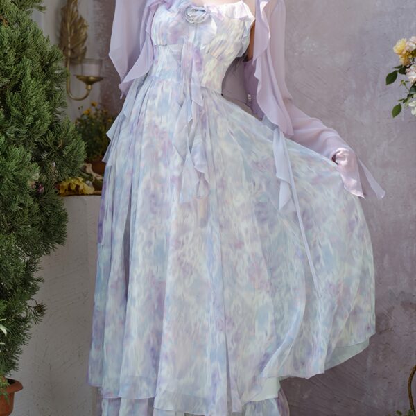 Effortless elegance in our Ethereal Bloom Floral Maxi Dress perfect for summer soirées and garden parties Model wears a flowing floral maxi dress with a flattering silhouette