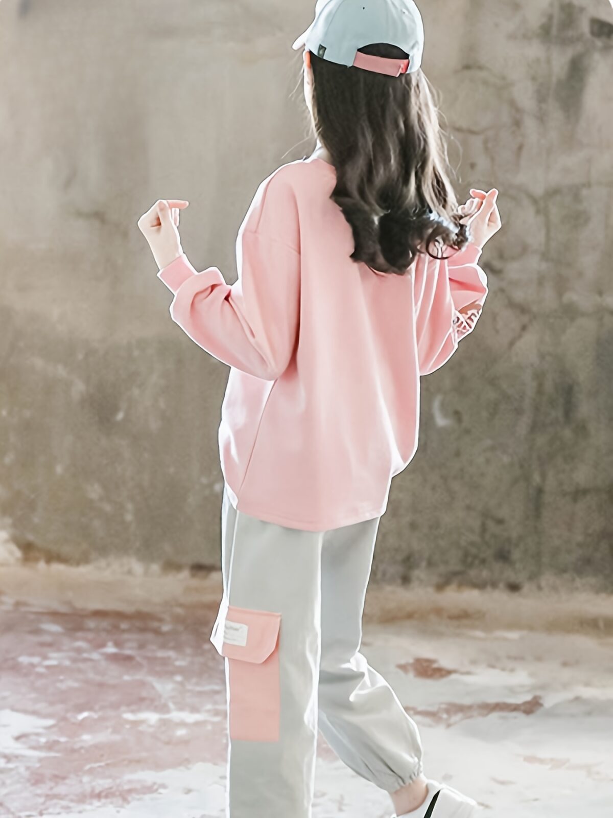 Adorable girls playful dolphin print suit in a comfortable loose fit perfect for spring and fall