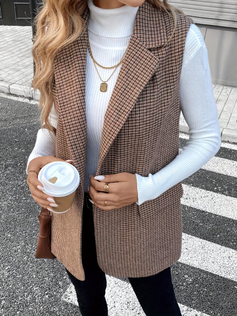 Newness City Chic Houndstooth Sleeveless Suit Jacket: A stylish houndstooth sleeveless jacket, perfect for layering over dresses or blouses during Fall/Winter. Versatile and chic.