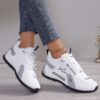 Newness City Chic Womens White Sneakers Chic sporty white sneakers perfect for everyday wear Close up view showcasing the stylish design and comfortable features