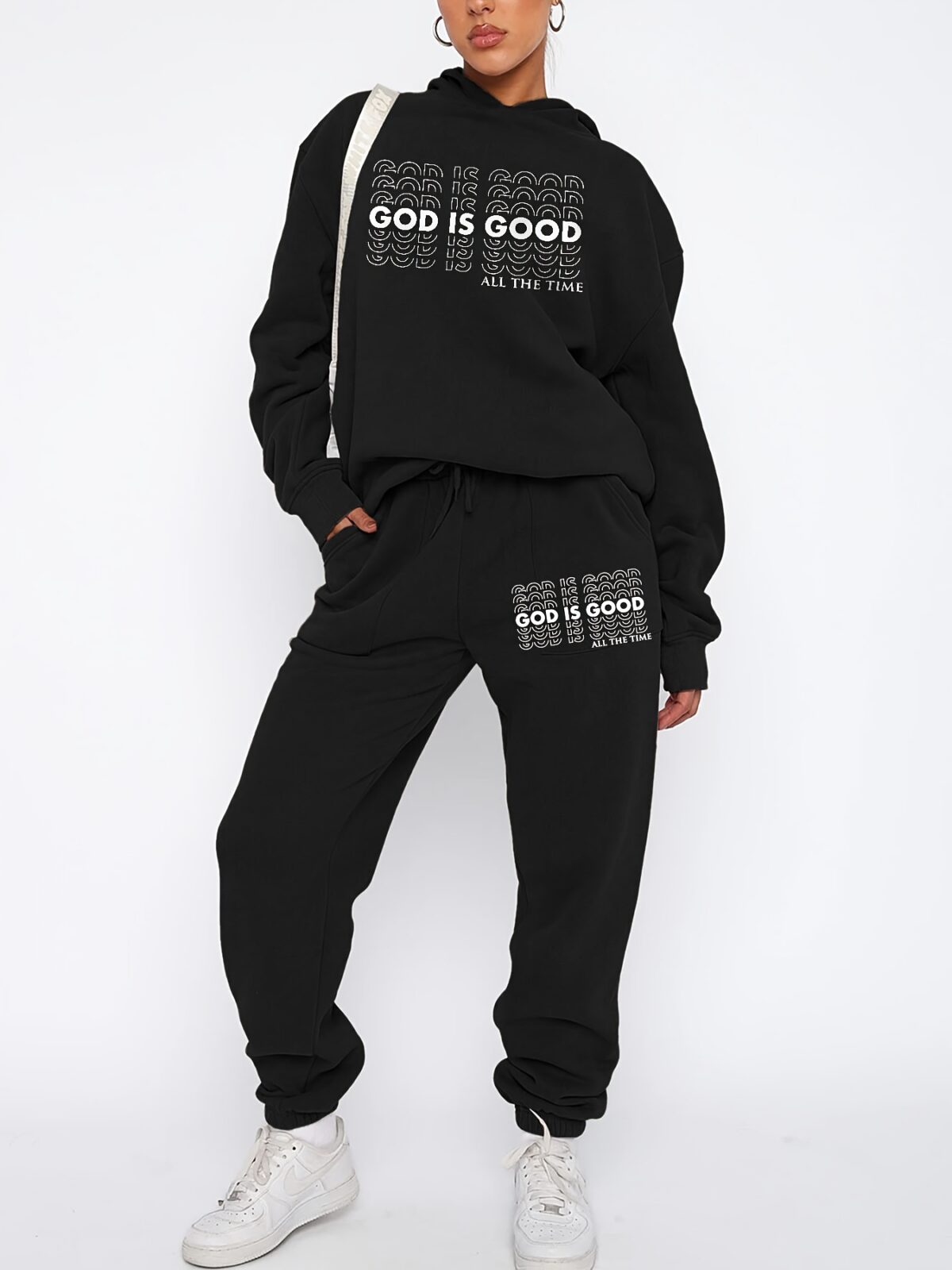 The Newness Minimalist Letter Print Two Piece Set in a cozy autumnal setting A stylish model wears the matching top and pants showcasing the comfortable fit and minimalist letter print Perfect for lounging or a casual day out