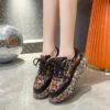 Elevate your style with Newnesss Elevated Rhinestone Platform Sneakers These hand stitched sneakers feature genuine gemstones and a chic platform sole