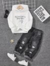 Stylish boys fashion hoodie and pants set in trendy design perfect for outdoor play or casual wear The comfortable two piece outfit is shown on a child model