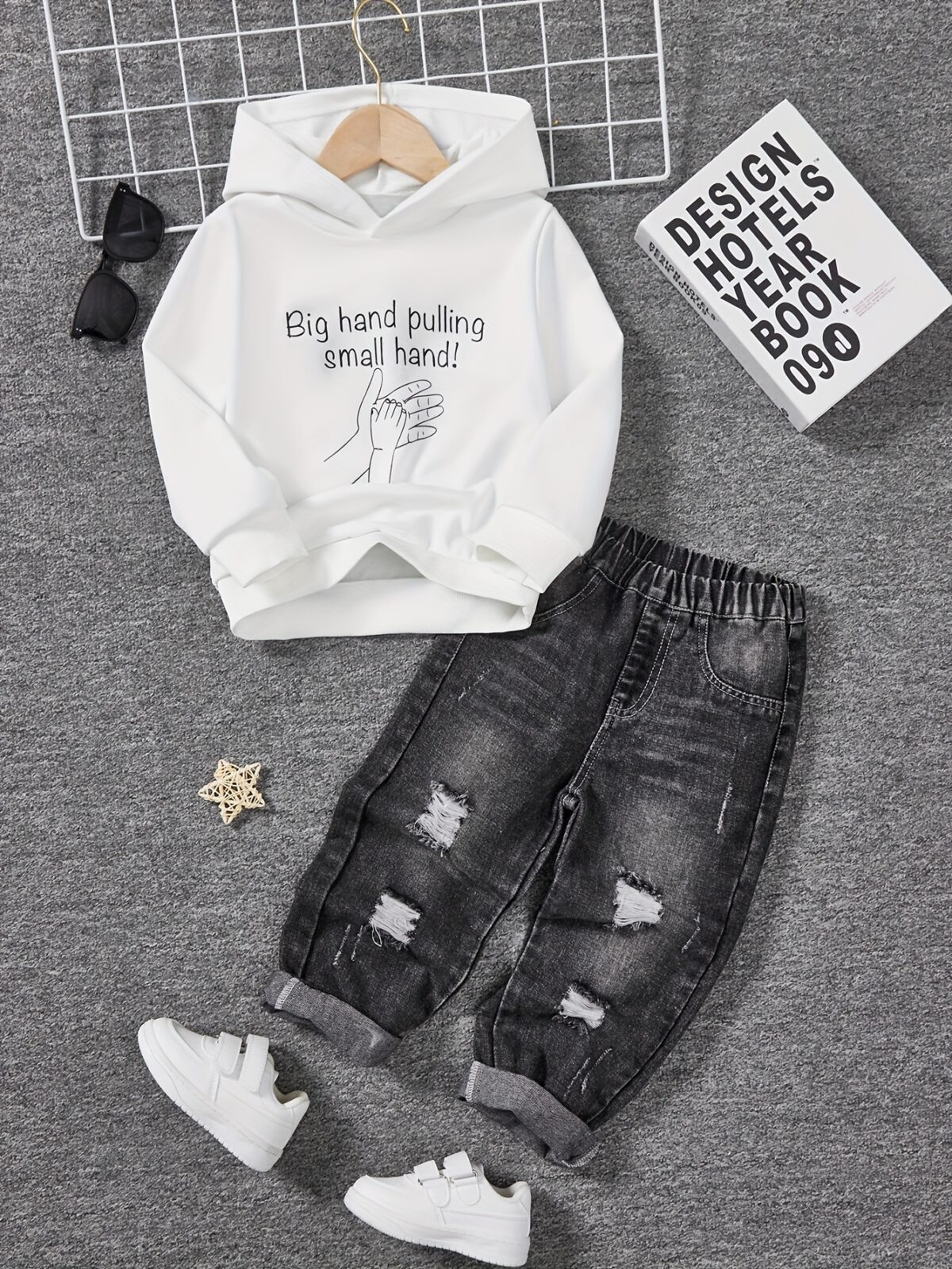Stylish boys fashion hoodie and pants set in trendy design perfect for outdoor play or casual wear The comfortable two piece outfit is shown on a child model