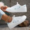 Newness Blush Butterfly Lace Up Sneakers Chic blush colored sneakers with butterfly accents and lace up closure perfect for spring