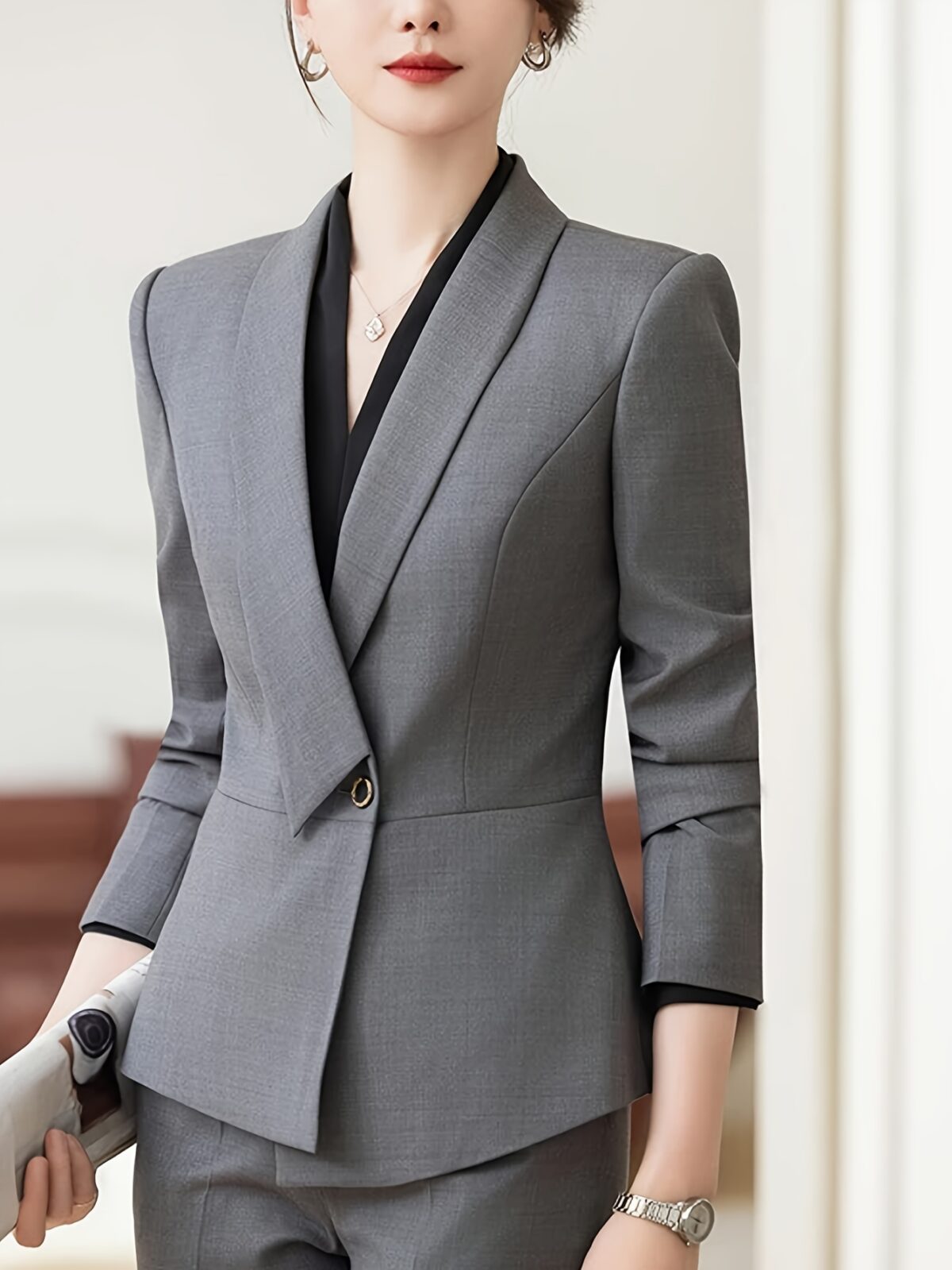 Womens elegant solid color blazer in a flattering tailored fit perfect for professional or casual wear Crafted from a comfortable polyester spandex blend