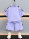 Stylish purple sports set for boys aged 12 and under Breathable polyester fabric ensures comfort and freedom of movement Perfect for summer activities