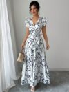 Embrace summer in the Newness Casablanca Floral Print Maxi Dress A chic flowing maxi dress with a vibrant floral print perfect for any occasion