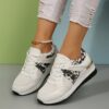 Newness Bloomsbury Floral Print Sneakers Comfortable and breathable floral print sneakers perfect for any occasion