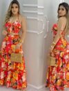 Model wearing the Newness Dubai Nights Tropical Print Suit a chic and effortless summer outfit perfect for a getaway The suit features a vibrant tropical print
