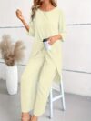 Effortlessly chic woman wearing the Jing Fei solid color pants set a luxurious polyester blend perfect for springsummer The model showcases the comfortable and stylish design
