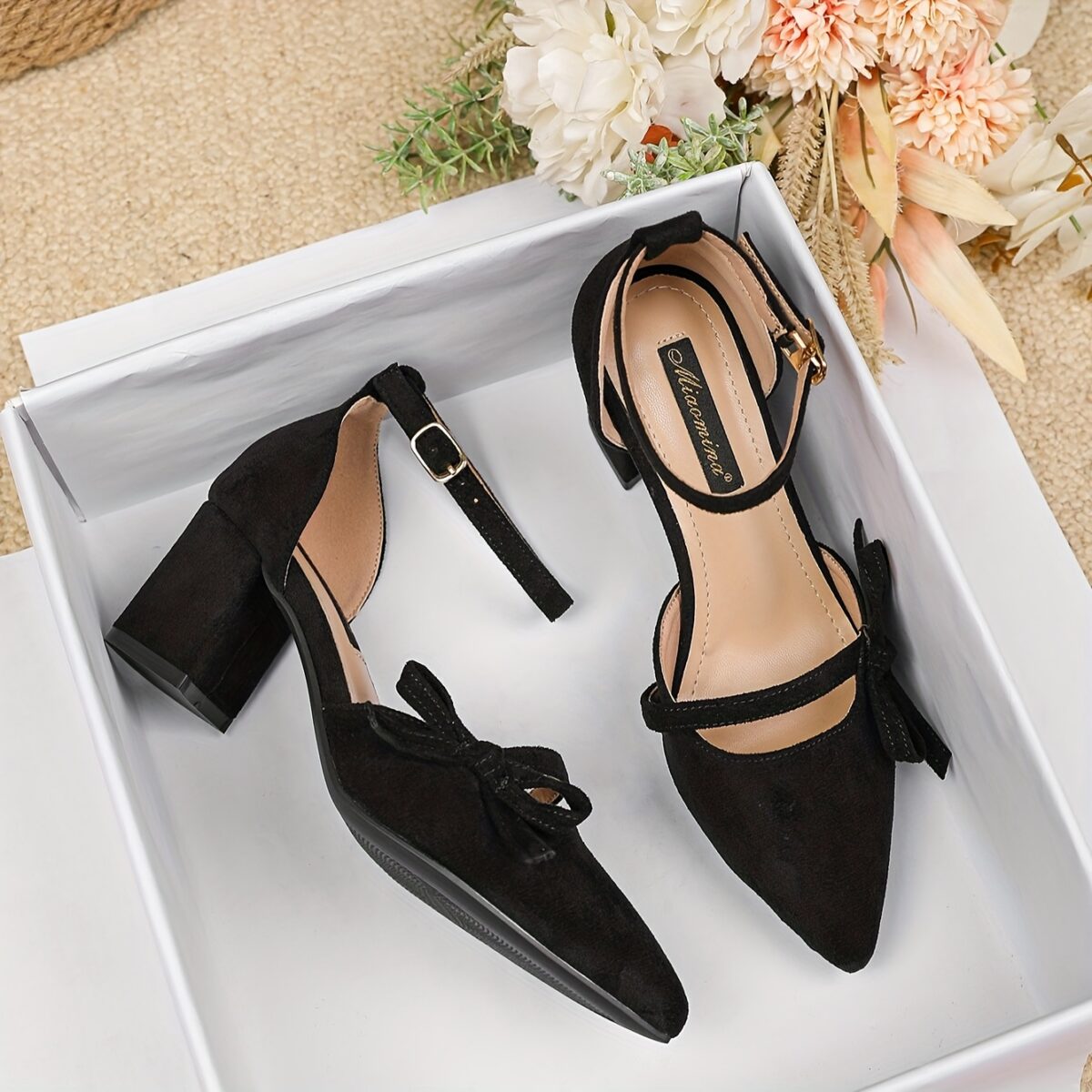 Newness Bow Detail Pointed Toe Pumps Chic wide width heels in black featuring a delicate bow mid block heel and durable rubber sole perfect for both casual and formal wear