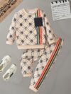 Stylish boys two piece outfit featuring a trendy N Y English letter print long sleeve t shirt and matching pants Perfect for city adventures and everyday wear