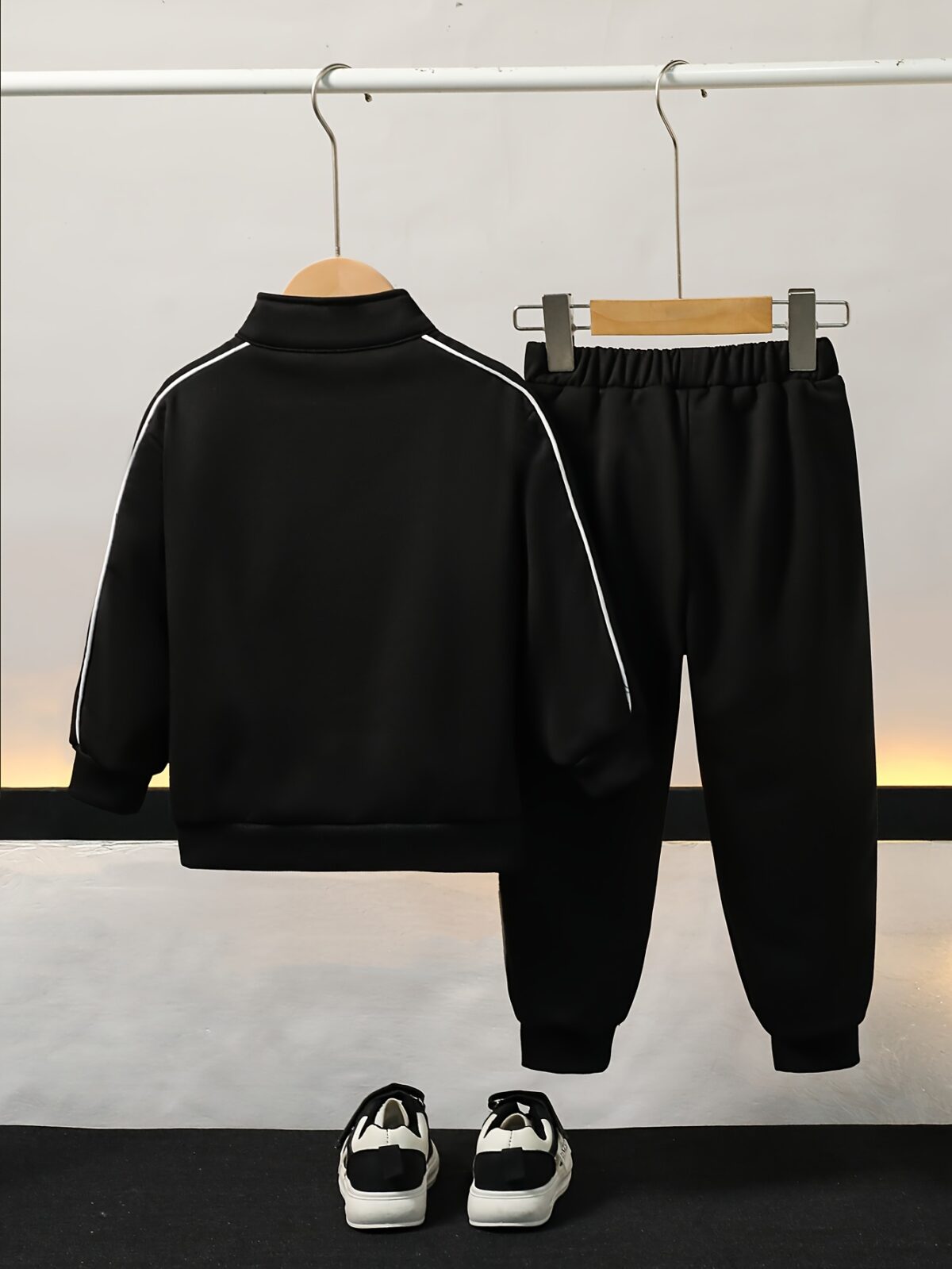Stylish boys tracksuit set in navy blue with white stripes perfect for active play or casual wear Features a comfortable long sleeve jacket and matching pants