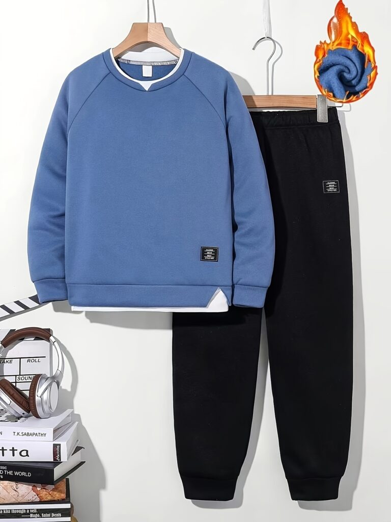 Stylish navy and black Junior Jetsetter boys' sweatshirt and jogger set, perfect for fall and winter. Comfortable and trendy for everyday wear.
