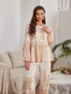 Model wearing a stunning two piece wide leg pants set with a vibrant Dubai Nights print The set is made of luxurious viscose