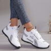 Newness City Chic Womens White Sneakers Chic sporty white sneakers perfect for everyday wear Close up view showcasing the stylish design and comfortable features