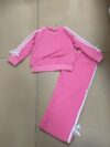 Girl wearing a stylish and comfortable two piece sweatpants set in soft stretchy fabric Perfect for everyday wear